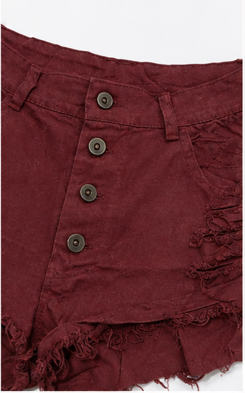 Short de mezclilla desgastado con botones al frente